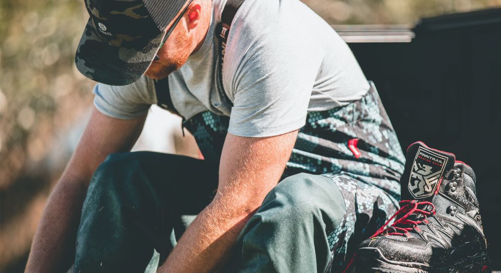 a man dresses Off-road boots