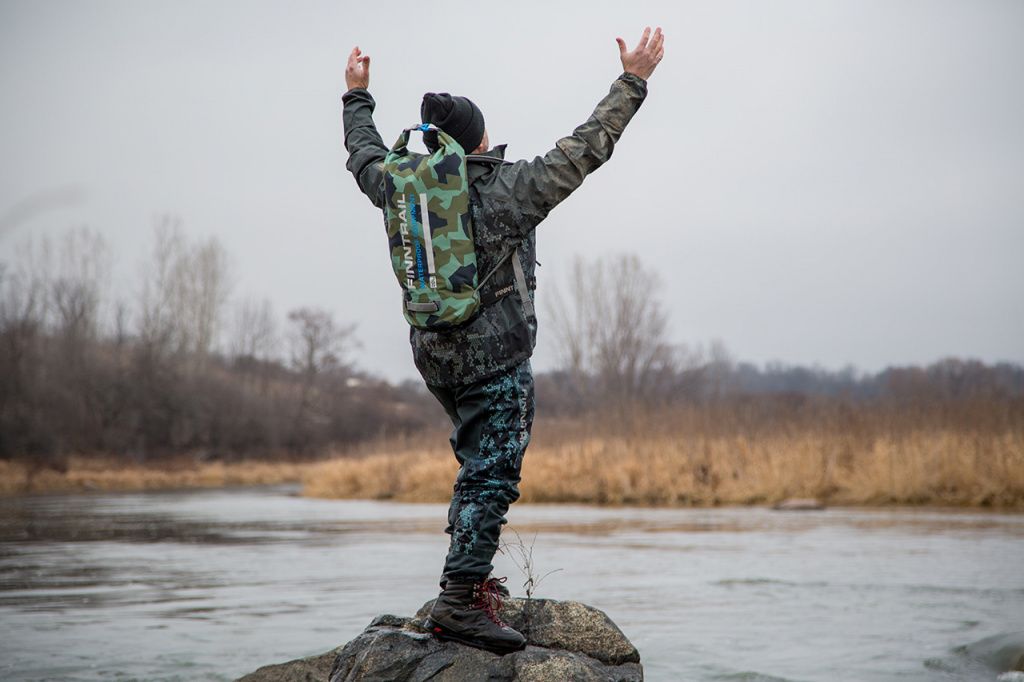 atv rider in waders and wading boots happiness freedom.jpg