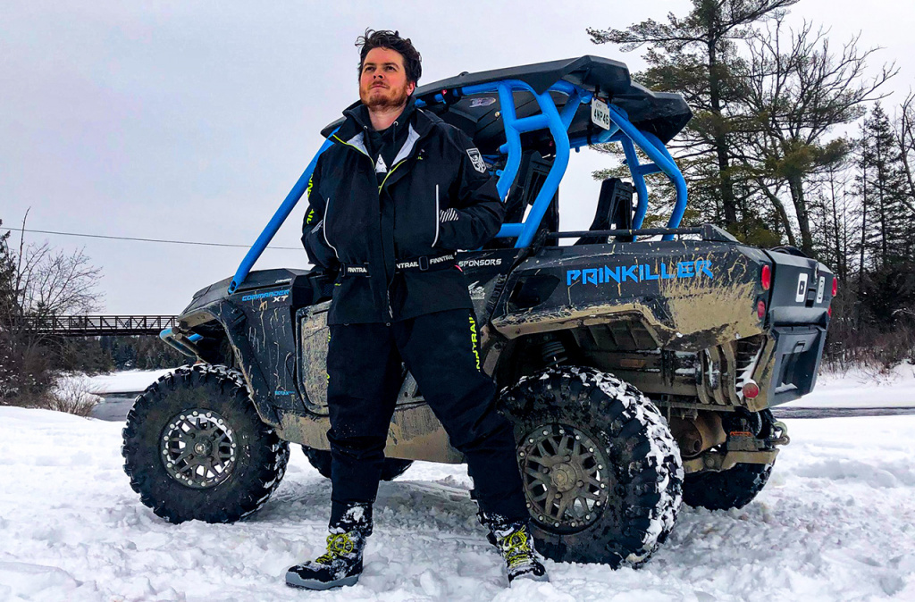 man and blue utv