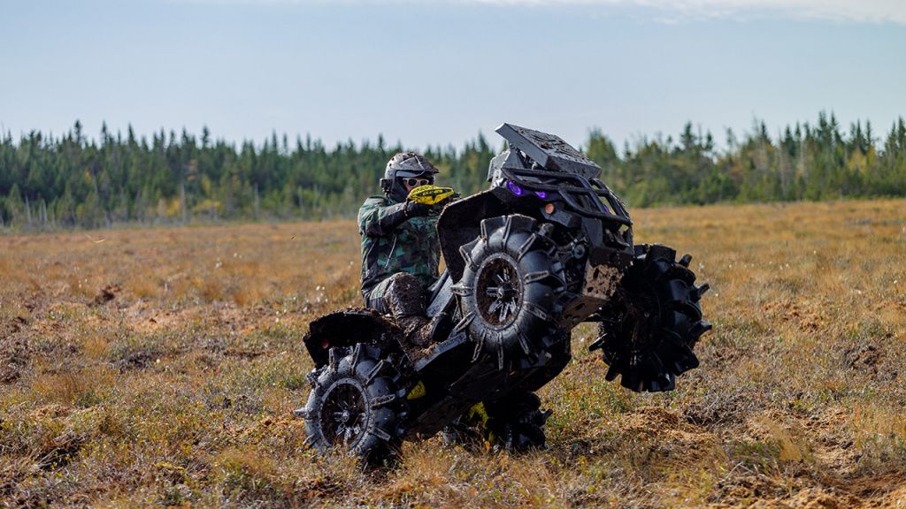 mud bogging on atv.jpg