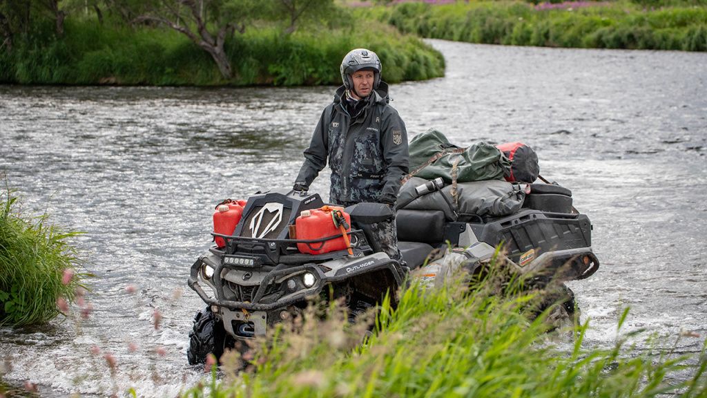 atv camping crossing stream